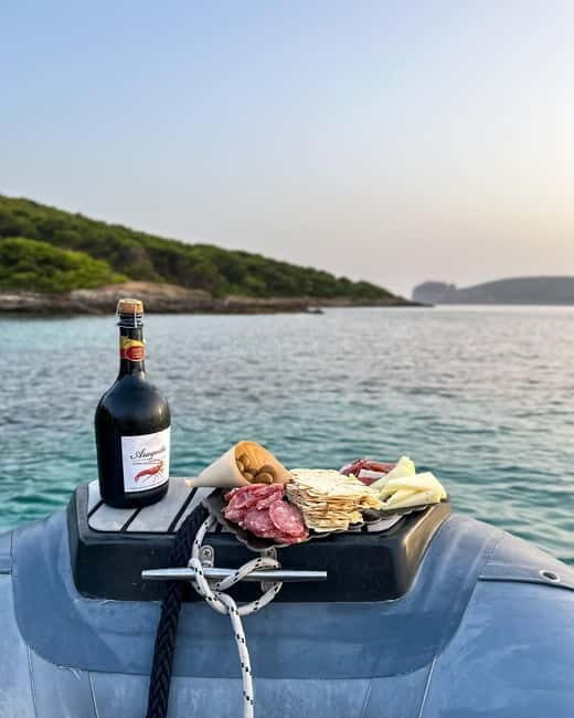 Alghero: boat tour with aperitif at sunset in Porto Conte - An Overview of the Experience