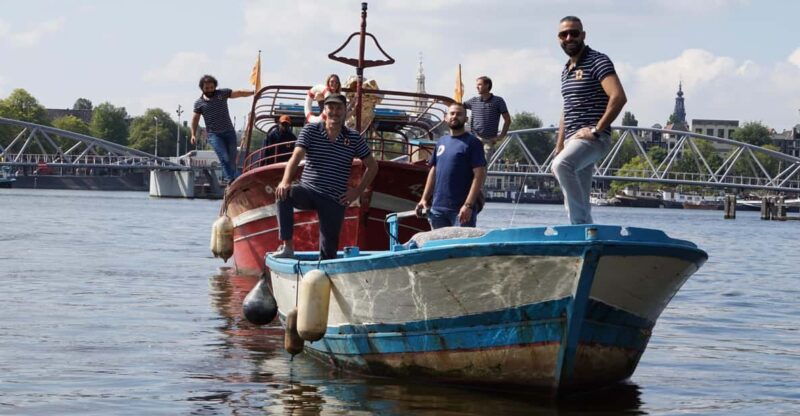 amsterdam-canal-cruise-on-a-wooden-refugee-boat