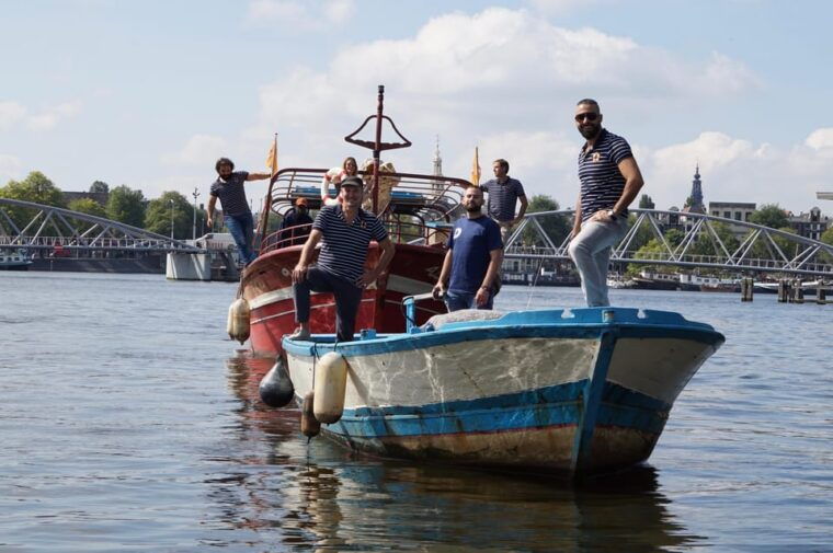 amsterdam-canal-cruise-on-a-wooden-refugee-boat