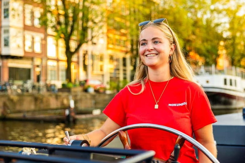 Amsterdam: Guided Open Boat Canal Cruise Including Drink - The Sum Up