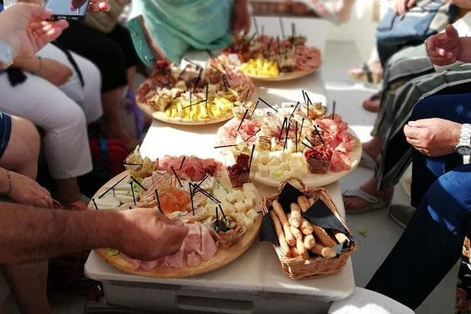 aperitif-on-the-boat-at-sunset-island-and-sea-caves