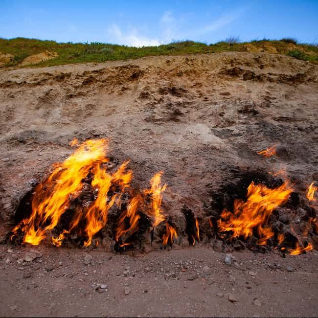 Baku: Gobustan, Mud Volcanoes, Fire Temple, & Yanar Dag Tour - Yanar Dag — The Ever-Burning Mountain  