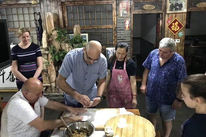 Beijing hutong rickshaw tour with homemade dumplings in family and Lama temple - Key Points