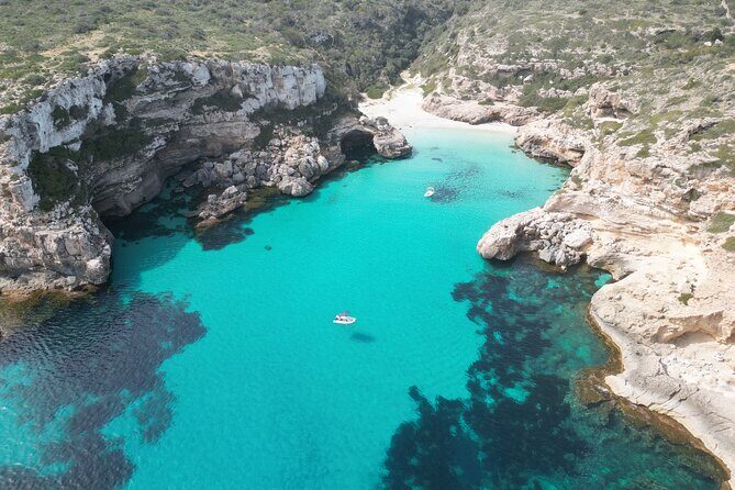 Boat tour Cala Figuera, Es Pontas, Caló de Moro, Cala Marmols - The First Swim Stop: Cala Llombards