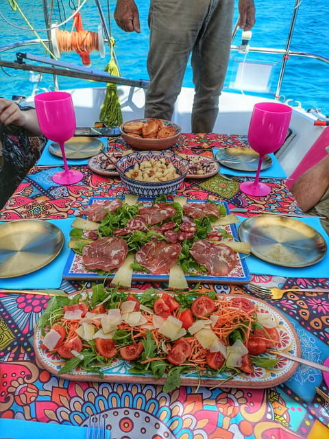 cagliari-relax-on-sailing-boat-with-a-rich-traditional-meal