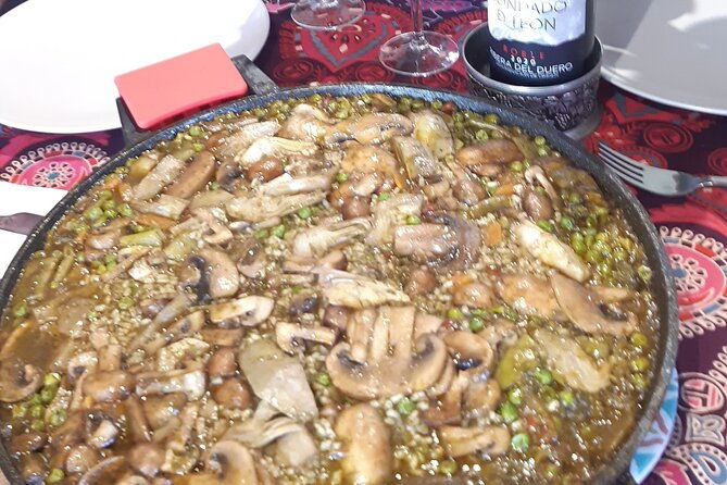chefcooking-paella-from-our-andalusian-grandmother-at-a-family-farm