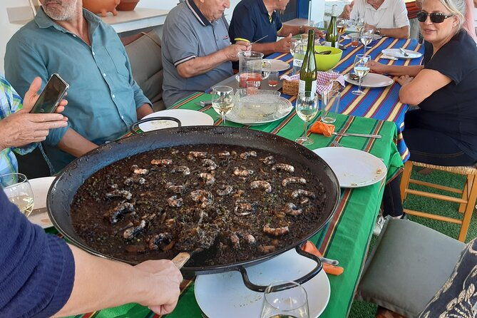 chefcooking-paella-from-our-andalusian-grandmother-at-a-family-farm