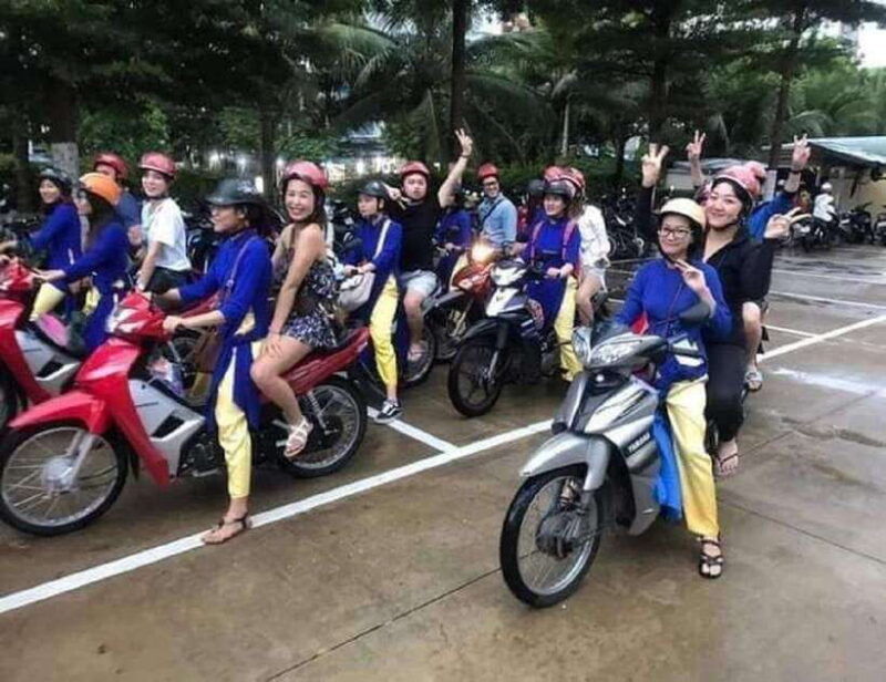 danang-night-city-scooter-tour-lady-aodai-rider-han-cruise