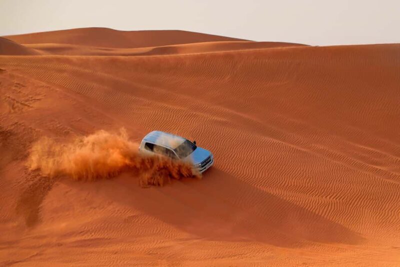 Dubai: Desert Safari, Quad Bike, Sandboarding, Camels & BBQ - Exploring Dubai’s Red Dunes: What You Can Expect