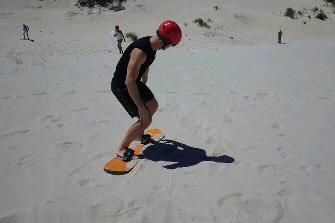 Explore Atlantis Sand Dunes with a 1hour 30mins sandboarding tour - Key Points