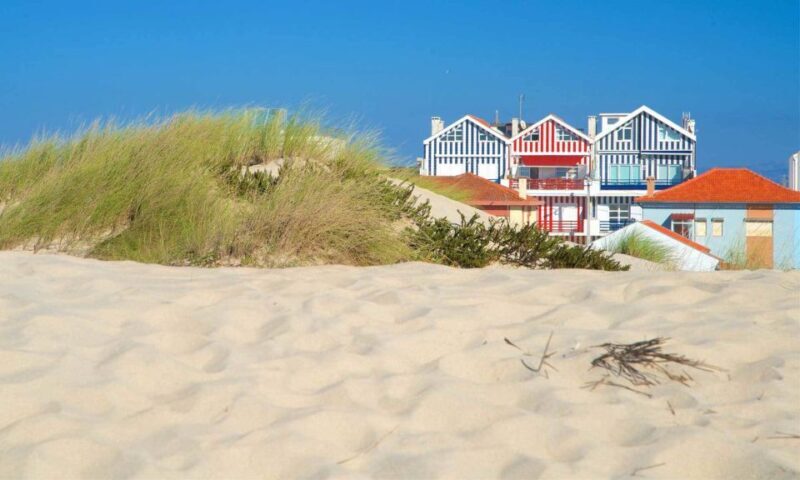 From Lisbon: Aveiro, Boat Ride, Costa Nova & Coimbra Private - Costa Nova: The Colorful Coastal Village