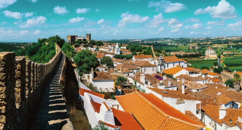 From Lisbon: Medieval Óbidos & Nazaré Coastal Charm Day Trip - Authentic Experiences and Tips