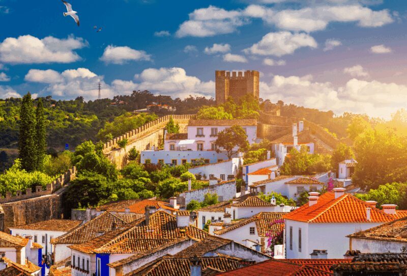 From Lisbon: Tour to Óbidos and Nazaré - Medieval Village, Ginja, and Surf Museum - Key Points