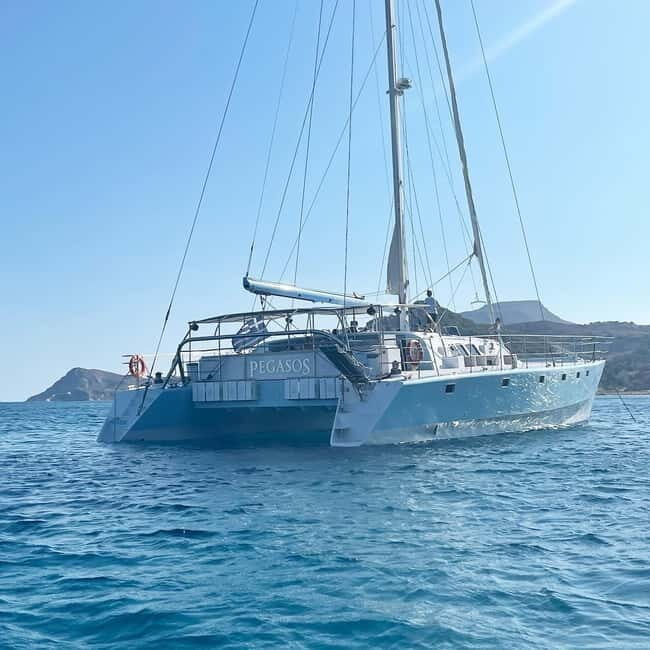 From Rhodes: Half-Day Catamaran Cruise with Swim Stops - An Authentic 3-Hour Sailing Experience