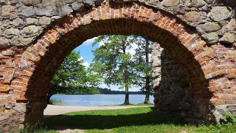 From Vilnius: Trakai Castle and Paneriai Memorial Tour - Free Time: Explore or Taste Traditional Food