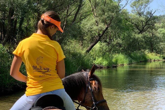 horseback-riding-across-river-ljuta-with-transport