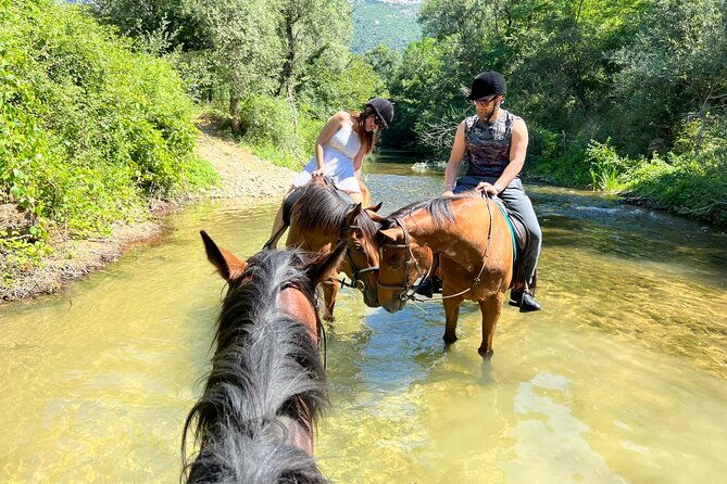 horseback-riding-across-river-ljuta-with-transport