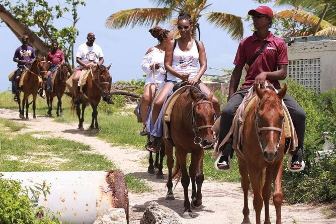 horseback-riding-at-hawksbill-beach-in-five-islands-antigua