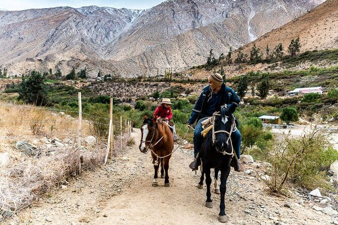 horseback-riding-river-and-mountain-range