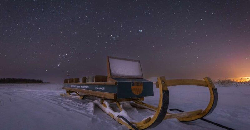 ii-snowmobile-sleigh-trip-on-frozen-sea-under-starlit-sky