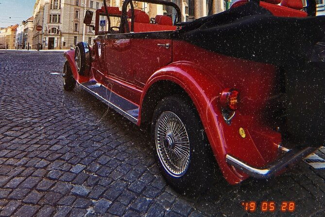 karlstejn-castle-in-vintage-convertible-car