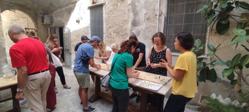 lecce-pasta-making-class-in-1400s-era-courtyard-with-wine