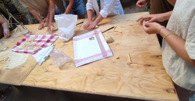 lecce-pasta-making-class-in-1400s-era-courtyard-with-wine