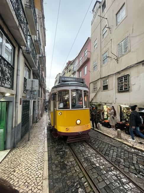 Lisbon: Walking Tour with Historic Tram 28 Ride & Tastings - The Sum Up