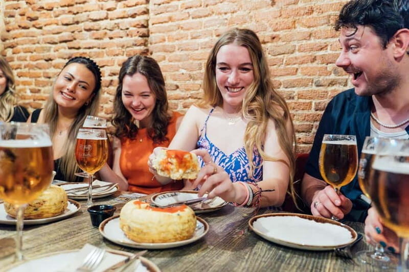 Madrid: Tapas Food Tour with 6 Tapas and 4 Drinks - The Guides and Experience Atmosphere
