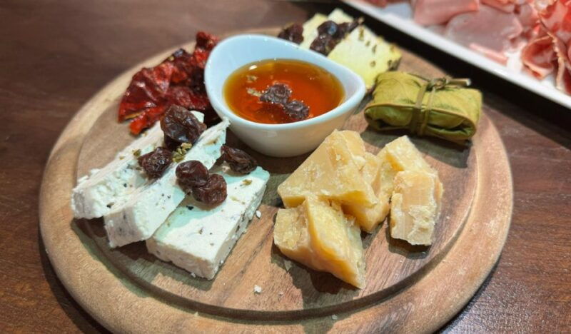 milan-aperitivo-with-food-selection-a-glass-of-wine
