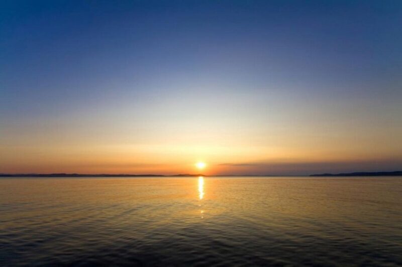 Mykonos: Private Aegean Sunset Cruise with Mykonian Platters - The Magic of the Sunset and the Scenic Highlights