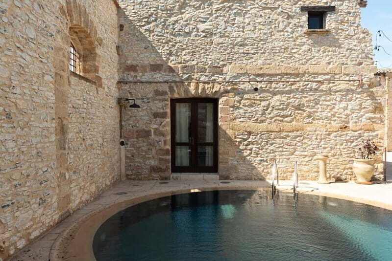 Nature and relaxation by the pool at Baglio Passofondo Estates - What Makes This Experience Stand Out?