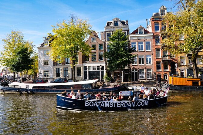 open-boat-canal-cruise-in-old-city-centre-of-amsterdam-2