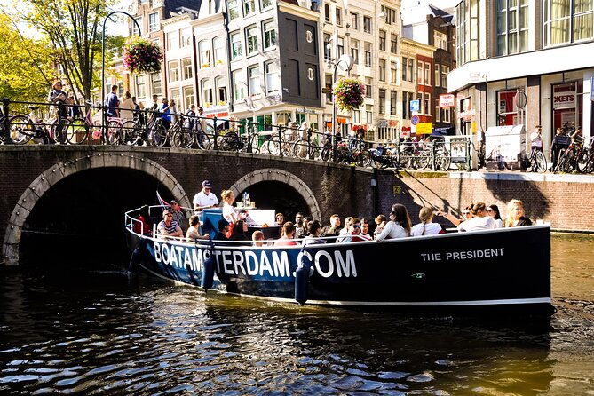 open-boat-canal-cruise-in-old-city-centre-of-amsterdam-2