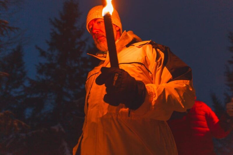 oslo-snowy-forest-torchlight-walk-with-campfire