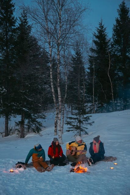 oslo-snowy-forest-torchlight-walk-with-campfire
