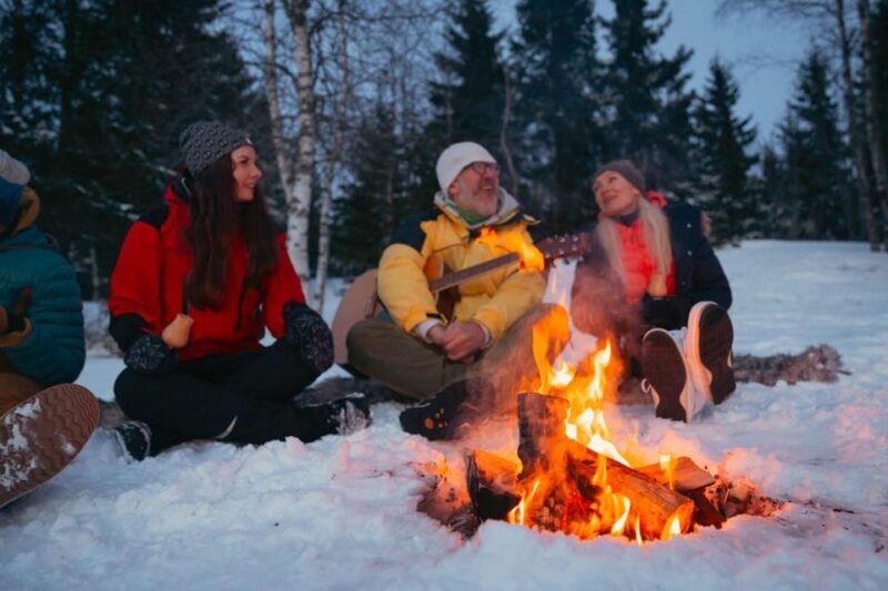 oslo-snowy-forest-torchlight-walk-with-campfire