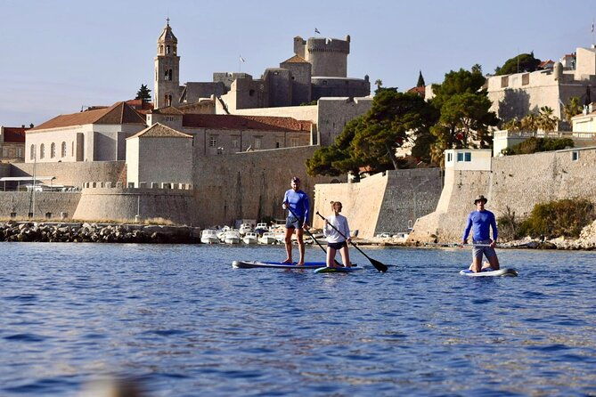 paddleboarding-in-front-of-the-old-town