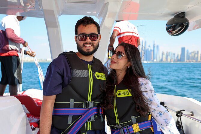 Parasailing in Dubai with Palm Jumeirah and JBR Beach views - Weather and Cancellation Policies