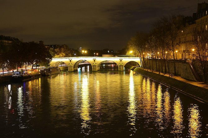 paris-by-night-with-seine-river-cruise-and-roundtrip-luxury-transportation