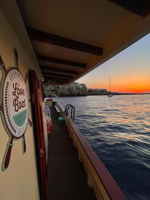 Polignano Monopoli: boat tour on a traditional wooden boat at sunset - A Detailed Look at the Polignano Monopoli Sunset Boat Tour