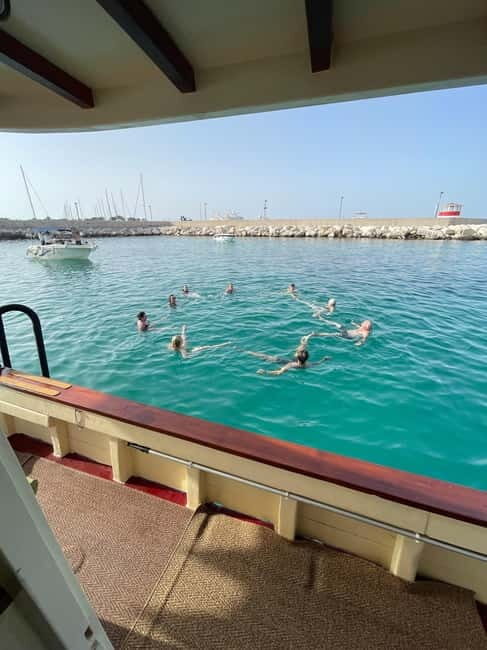 Polignano Monopoli: boat tour on a traditional wooden boat at sunset - Pricing and Value