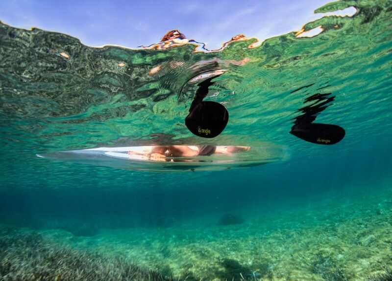 pula-clear-kayak-tour-to-canyon-island-cliffs-small-cave