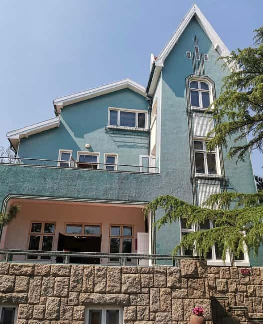 Qingdao: Badaguan Scenic Area Guided Walking Tour - Key Points