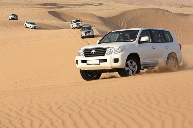 Red Dunes Desert Safari with Buffet Dinner and Sand Boarding - First Stop: The Dunes and Optional Quad Biking