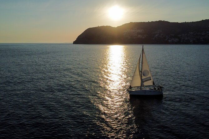 sailing-at-sunset-along-the-cliffs-of-maro-compartida