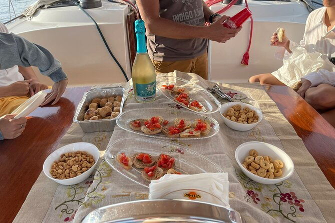 sailing-boat-with-aperitif-at-sunset-in-cilento