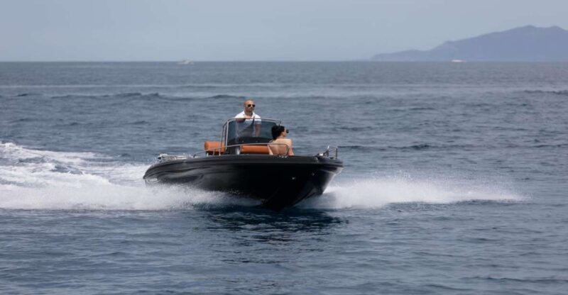 Santorini: License free Luxury boat and snorkeling included - The Sum Up