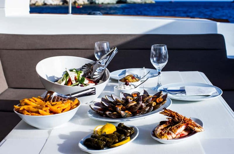 Santorini: Private Catamaran Cruise with BBQ Meal and Drinks - Relaxing and Sunbathing in Style