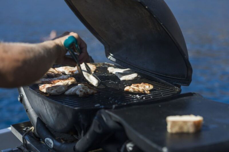 santorini-traditional-wooden-boat-tour-with-meal-and-wine